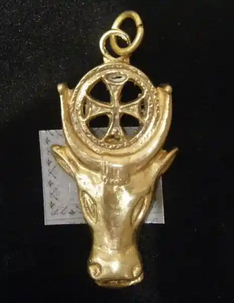 A cross inside the solar disc in between the horns of Apis an Egyptian bull deity A cross inside the solar disc in between the horns of Apis an Egyptian bull deity